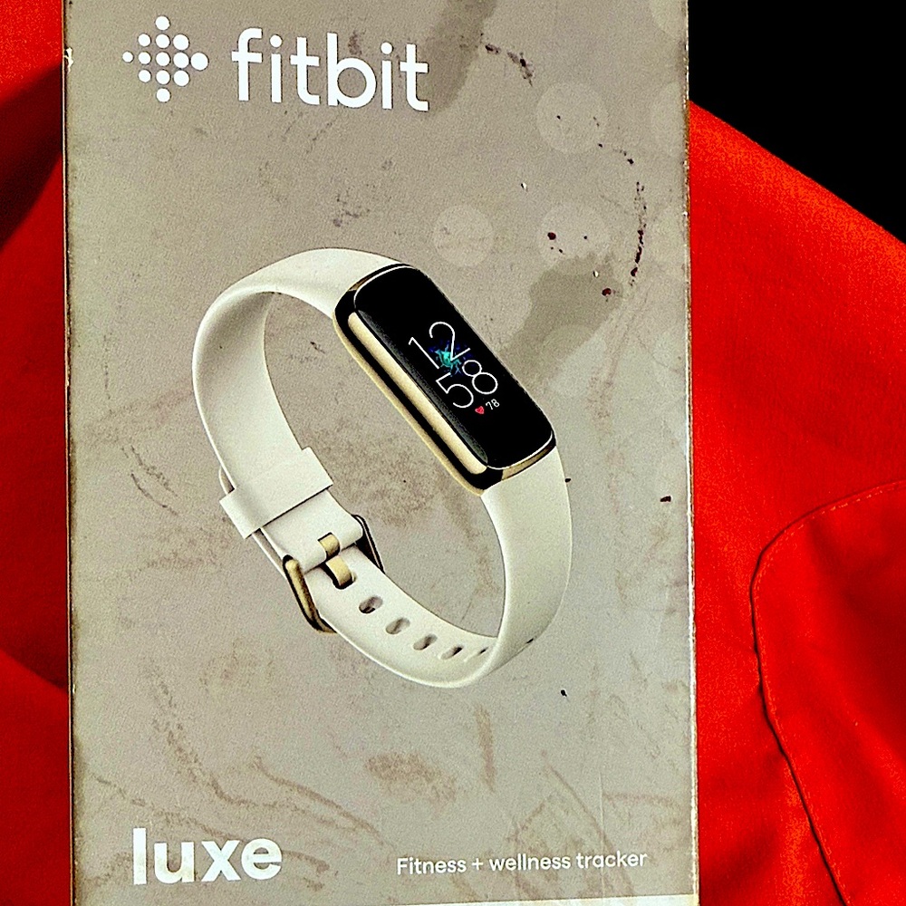 Fitbit luxe new never worn soft gold stainless steel white band